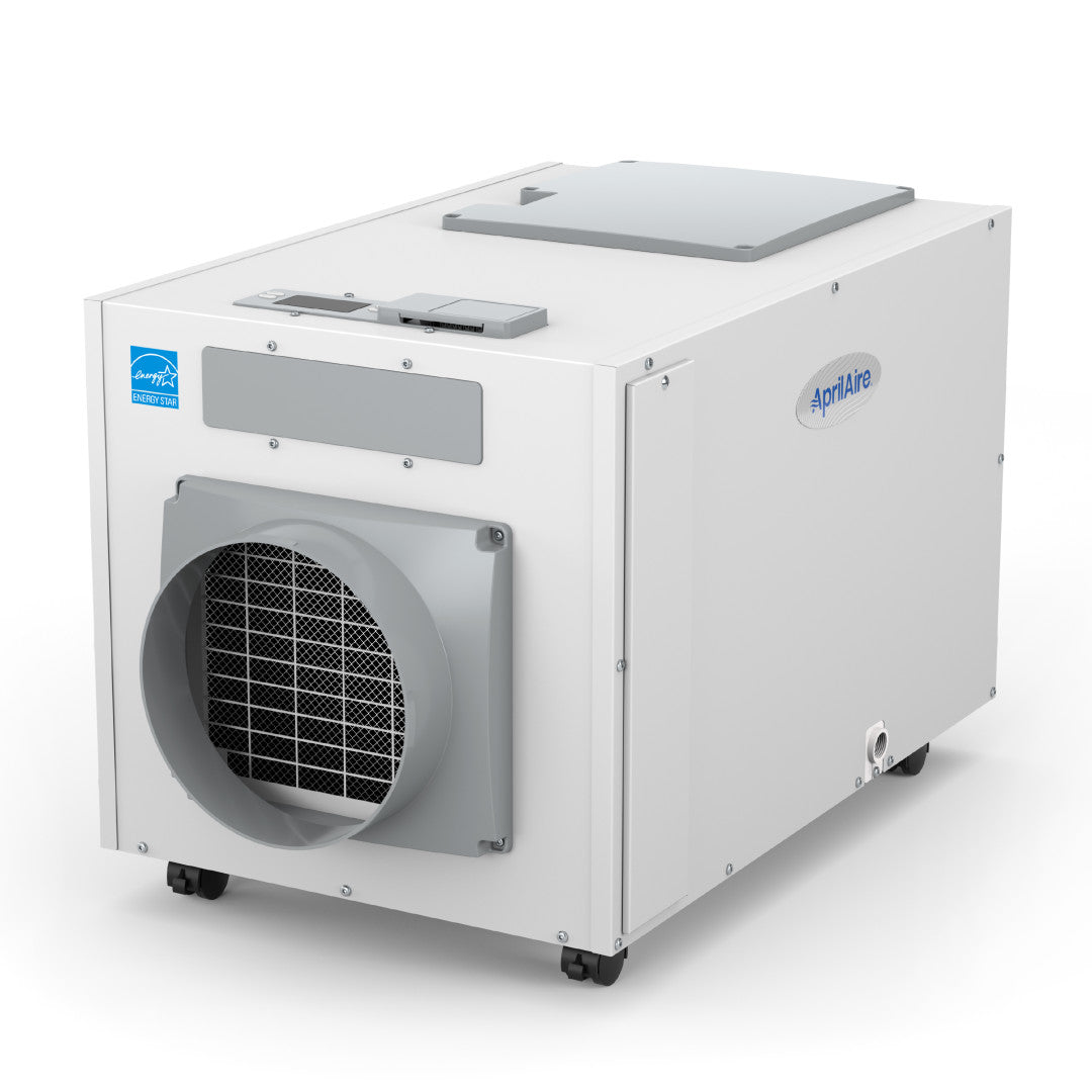White AprilAire E130C cabinet in three-quarter view with four small caster wheels, front circular duct opening, control panel, side access and lower drain fitting.