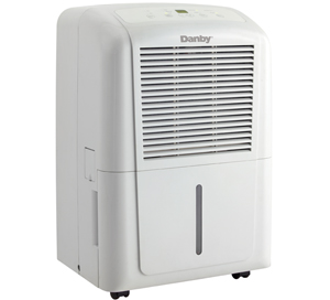 Front view of Danby DDR6511, a white dehumidifier with upper air grille, water-level window and casters.