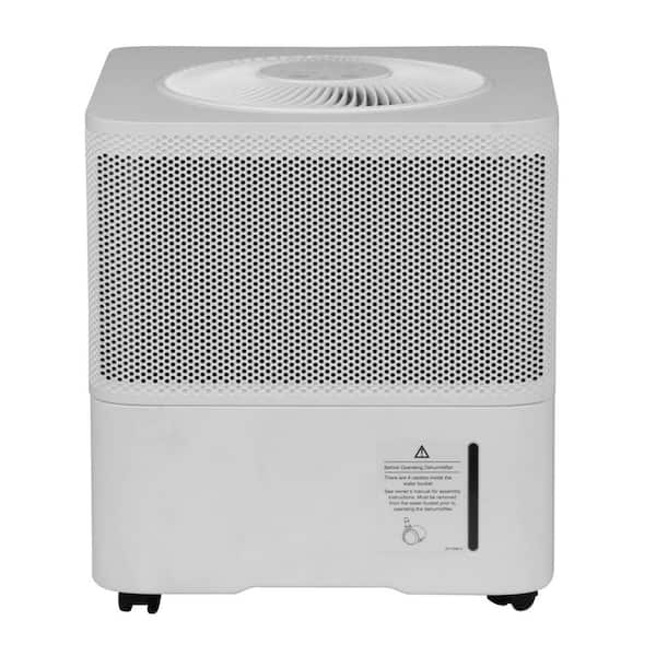 White compact GE ADSE35WWT dehumidifier exterior with circular top outlet, perforated side housing and casters; the image does not show pump internals or an identity plate.