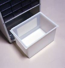 Close-up of an empty white collection bucket partly pulled from a dehumidifier cabinet; GE links this detail image to the AHG50LA removable-bucket feature.
